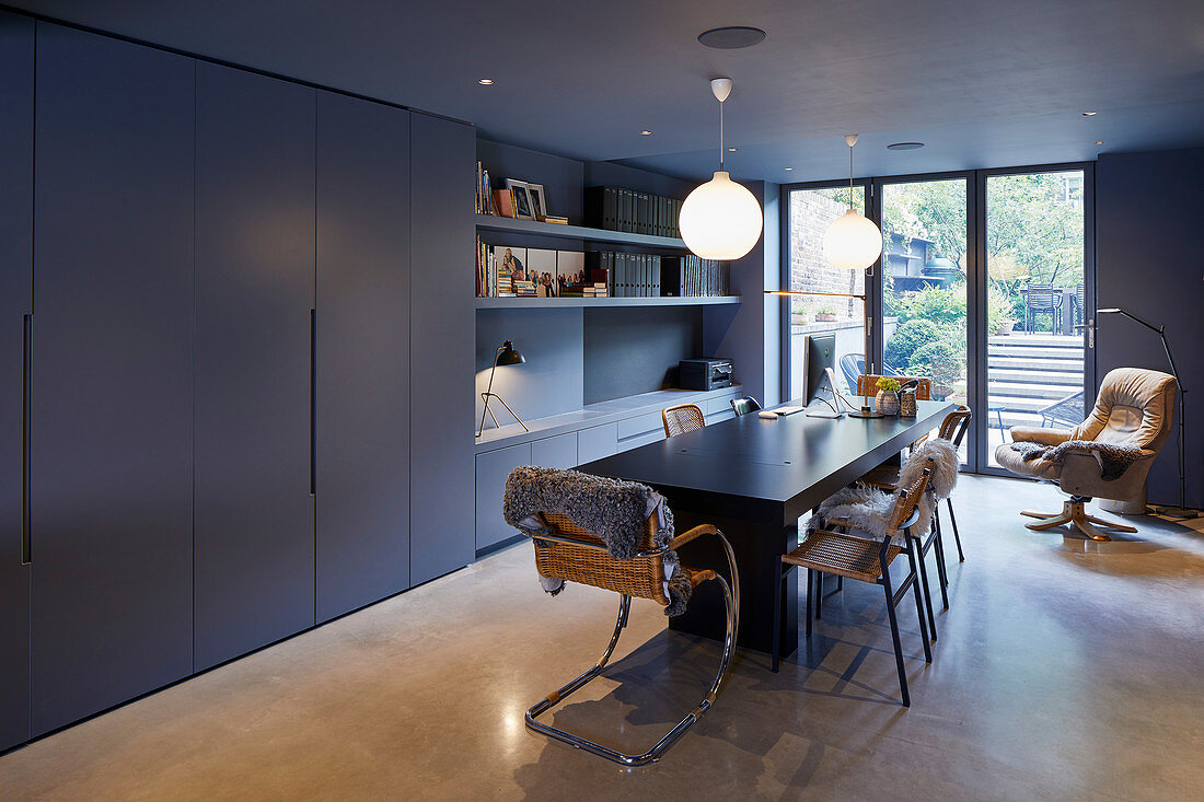 Fitted cupboards in modern dining room in shades of grey