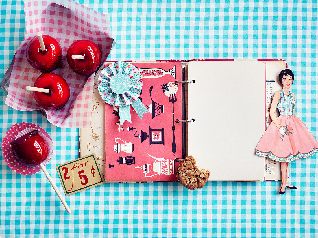 Paper doll and nostalgic recipe book on blue plaid