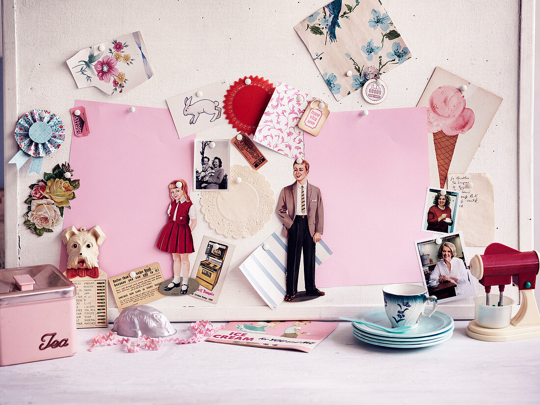 Pin board with nostalgic cutouts and paper dolls