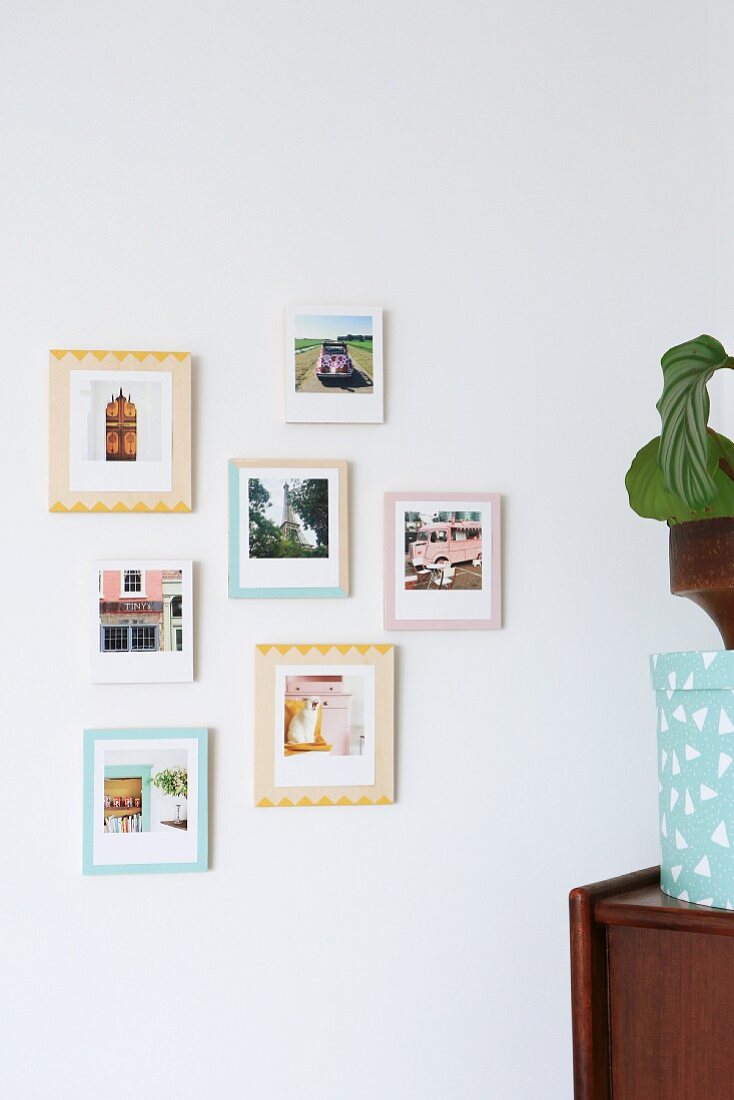 Photos on various painted wooden boards used as frames