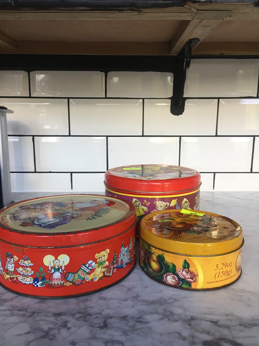 Old biscuit tins before a makeover