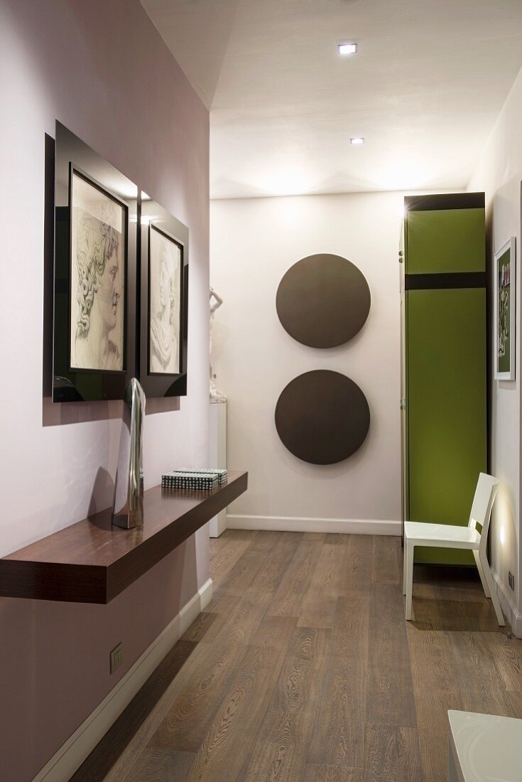 Pictures and circular wall decorations in modern hall