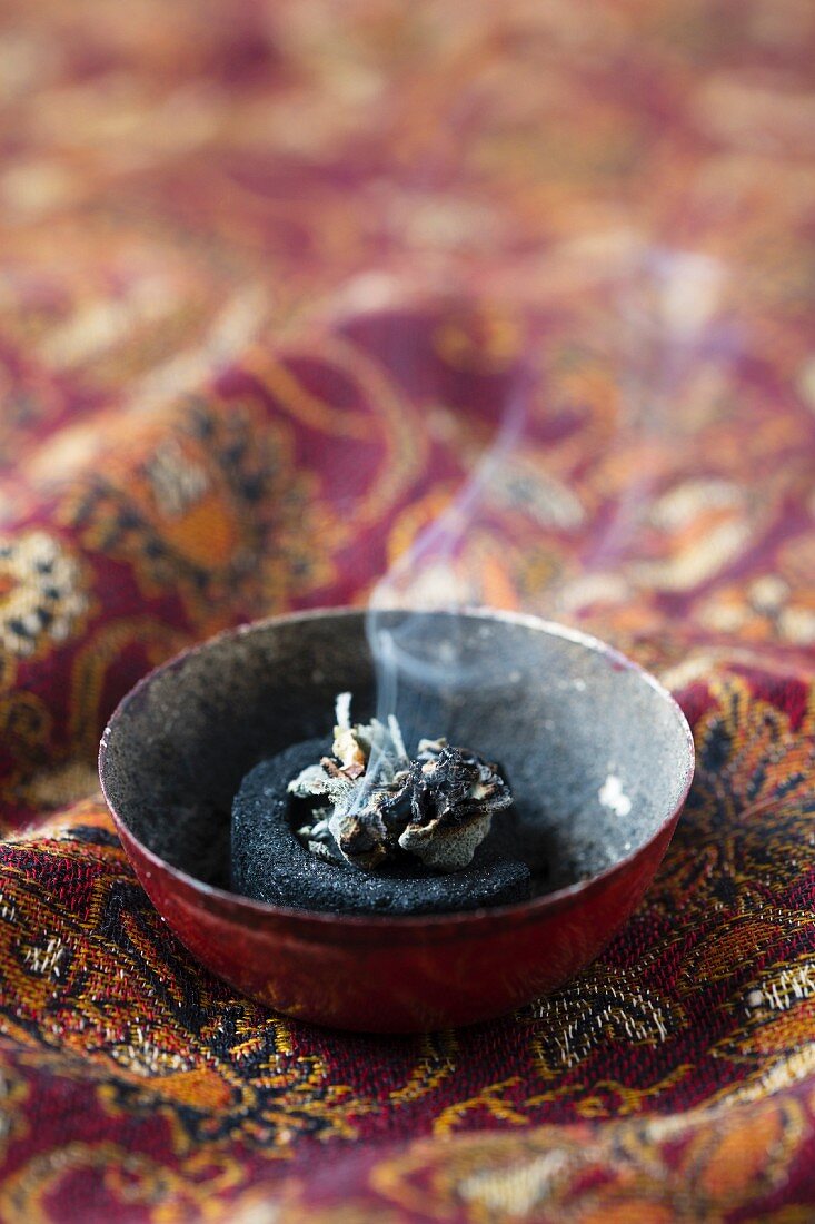 Incense charcoal and sage