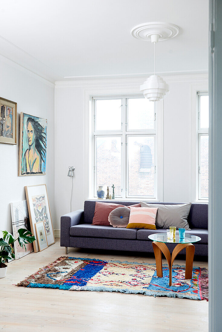 Colourful vintage accessories in white living room