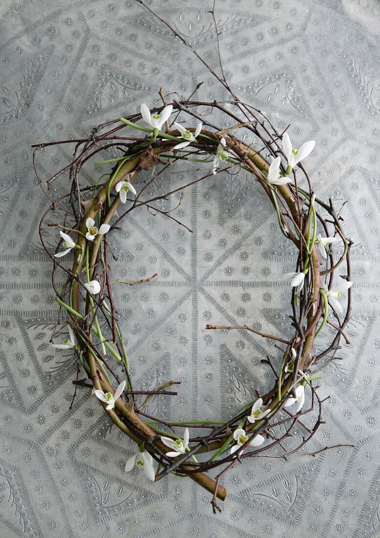 Wreath of woven willow twigs and snowdrops