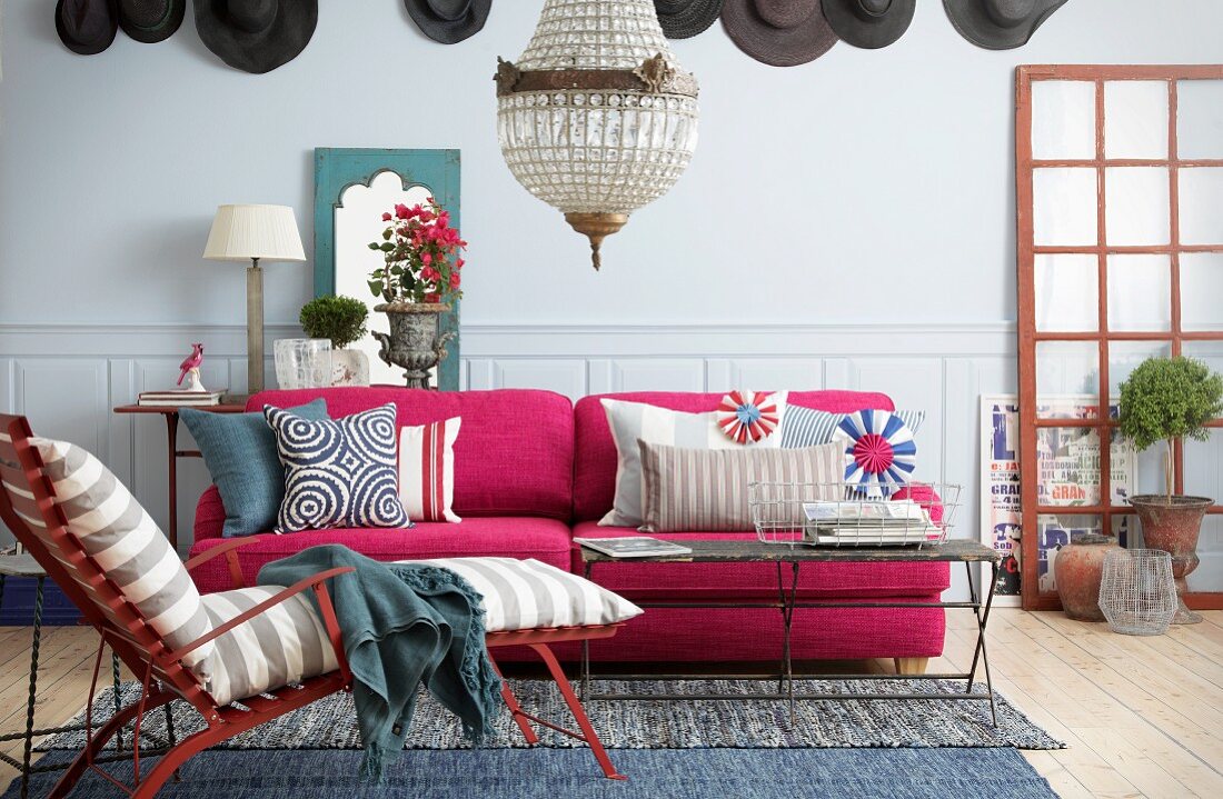 Pink sofa in colourful living room