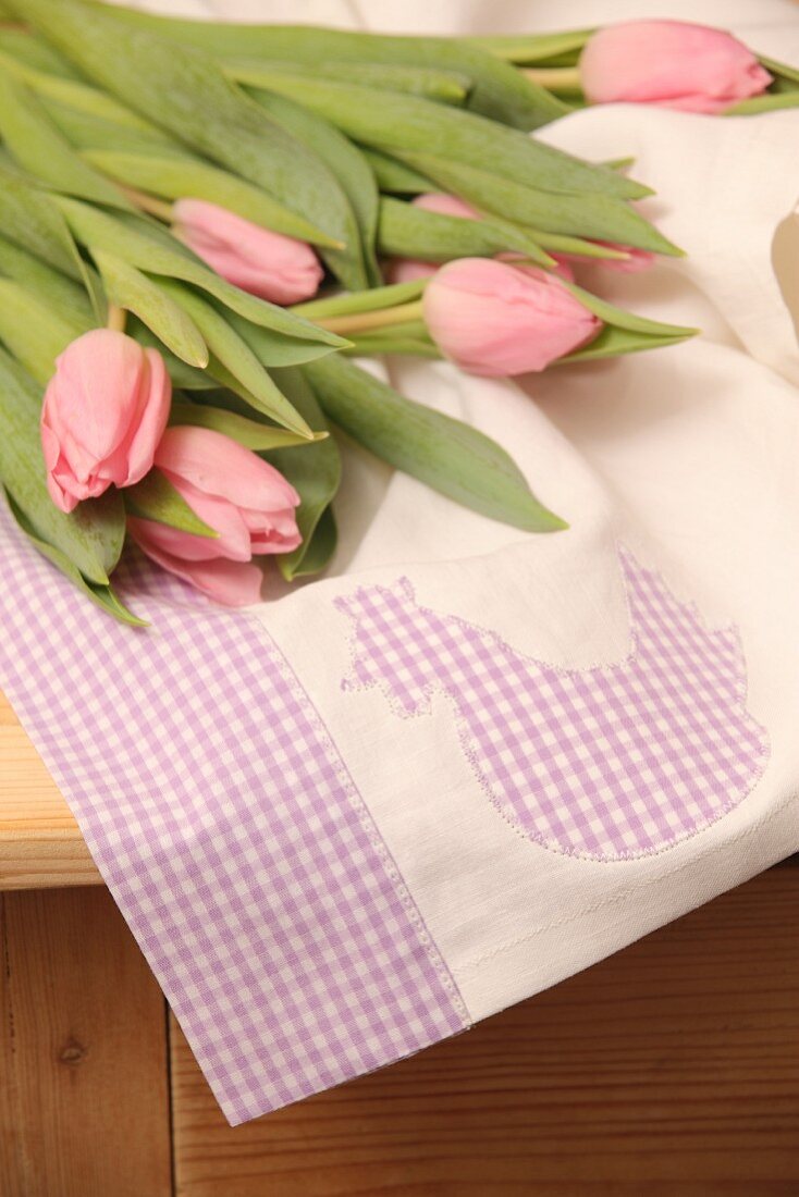 Pink tulips on hand-sewn tea towel with Easter motif