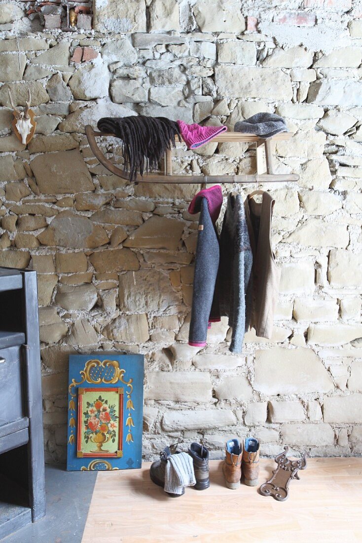 Old sledge use as wall-mounted coat rack