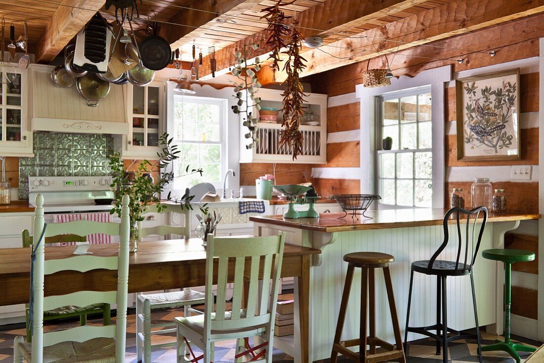 Wooden furniture and exposed beams in rustic kitchen
