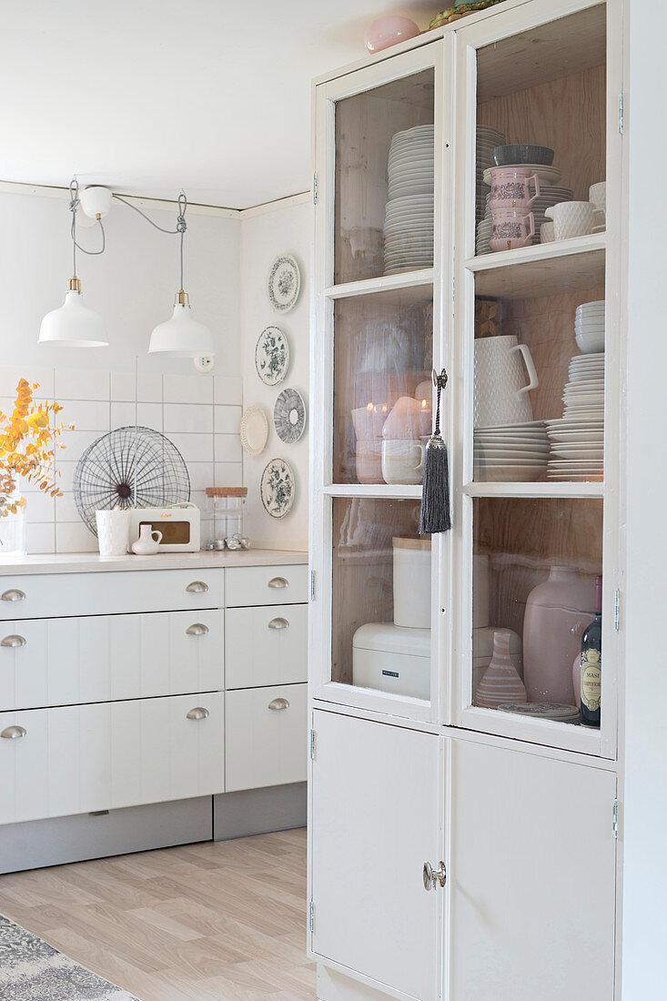 Cupboard in white country-house kitchen
