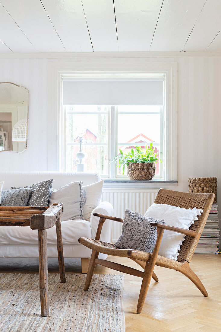 Retro wooden armchair in Scandinavian living room