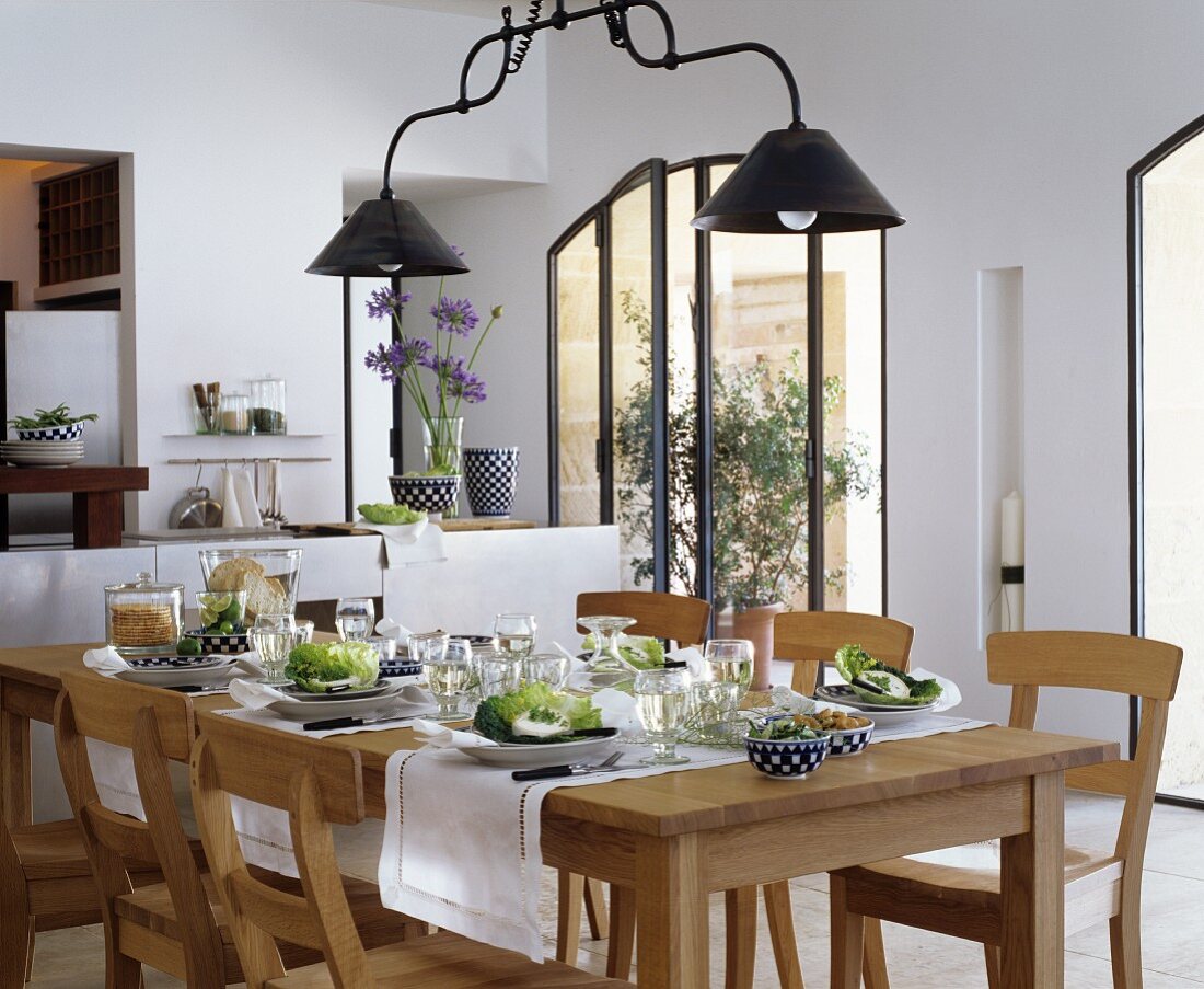 Set oak table in Mediterranean dining room