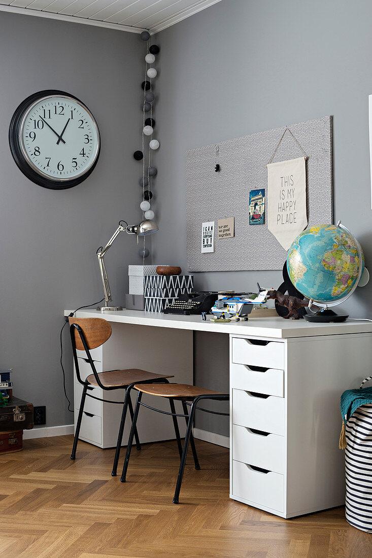 Desk with drawers in boy's room in shades of grey