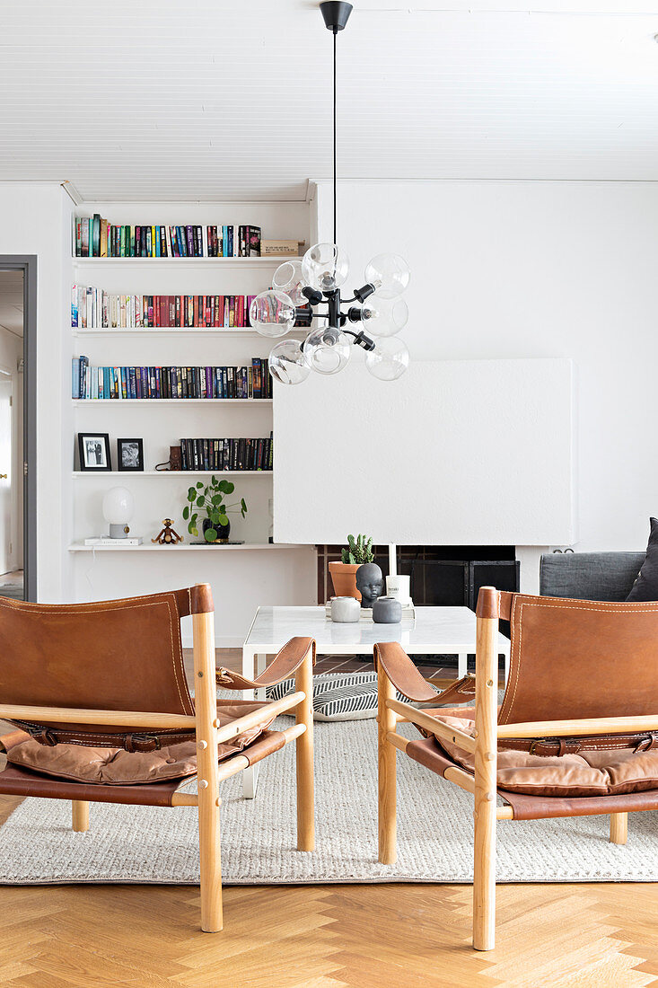 Scandinavian chairs with leather seats and backs in living room