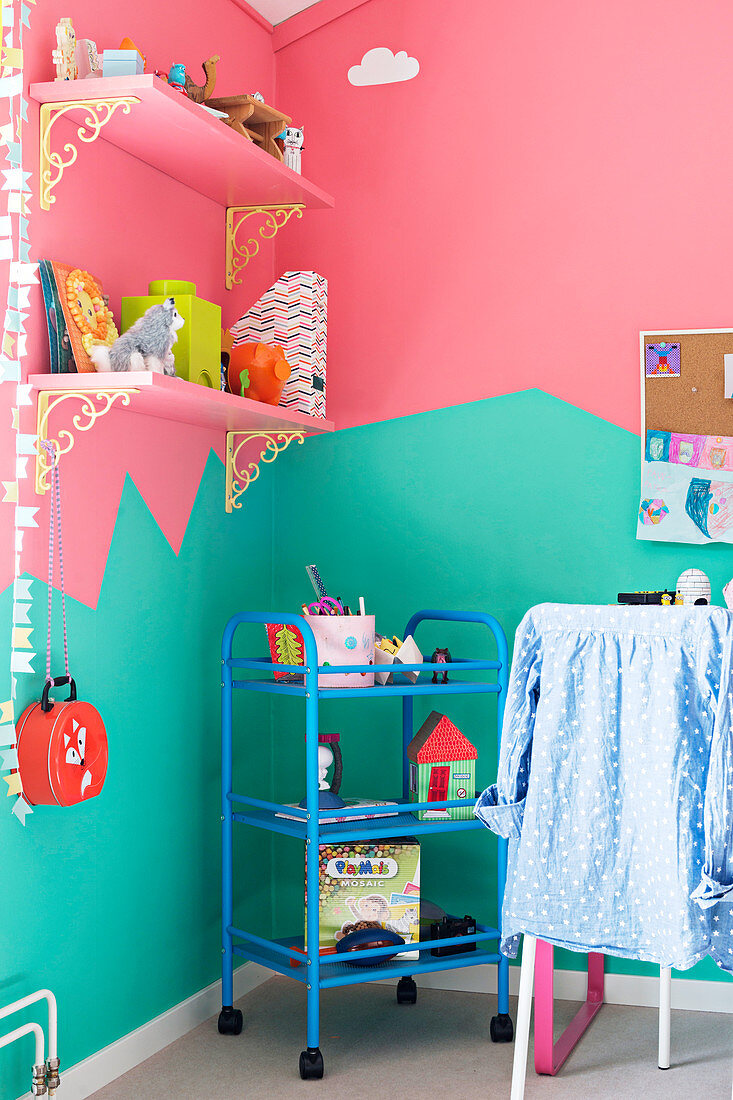 Child's bedroom with bicoloured walls in mint and pink