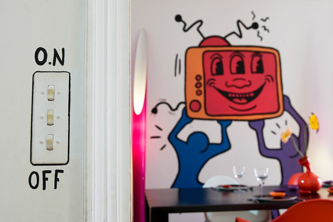 Light switch with comic-style border and pop-art mural