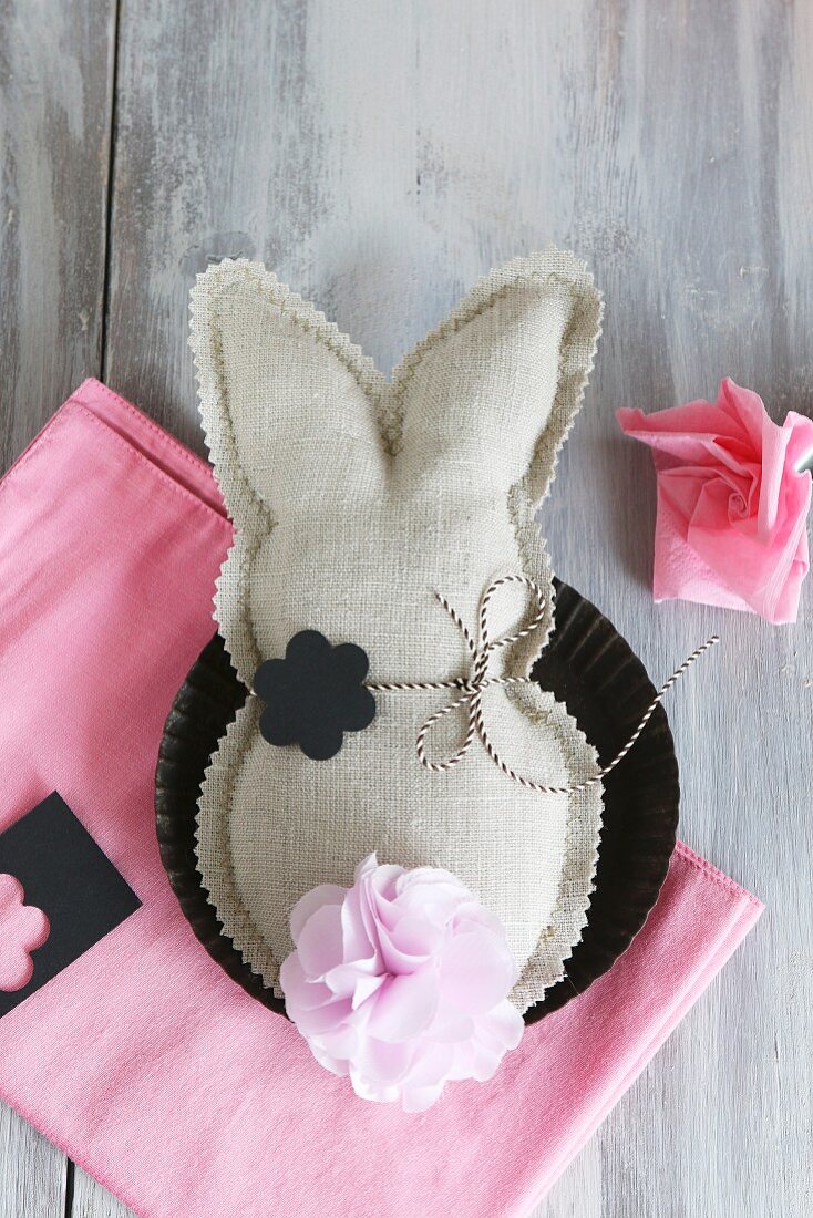 Fabric rabbit with zig-zag edge and paper flowers