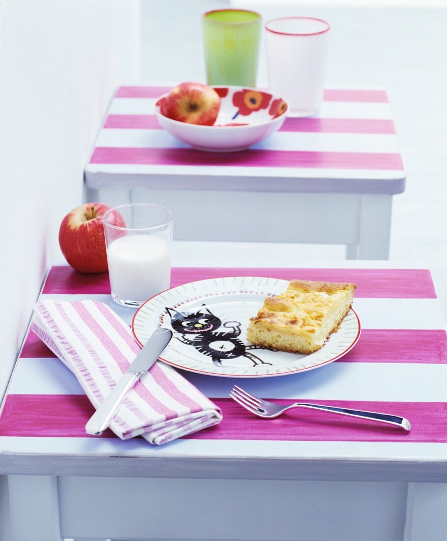 Breakfast arranges on stools with pink-striped tops used as children's tables