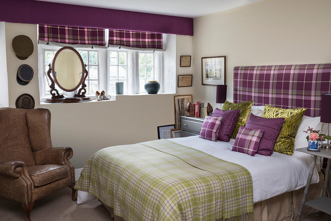 Tartan textiles in English-style bedroom