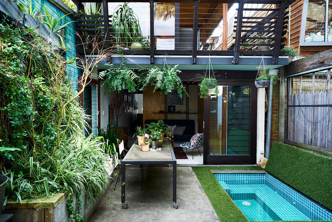 Small courtyard garden with mini pool and vertical planting