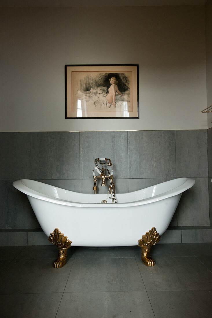 Classic, free-standing, clawfoot bathtub in modern bathroom