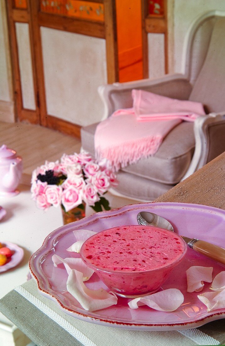 Pink desert and rose petals on pink plate