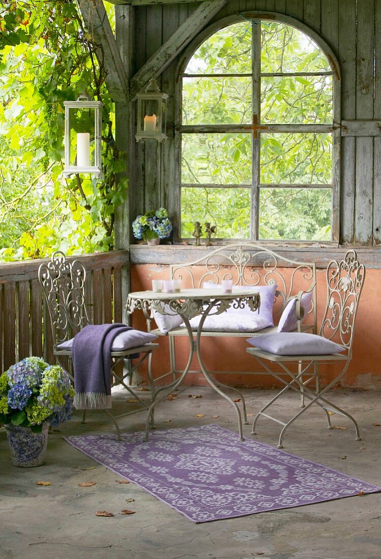 Ornate metal furniture on romantic veranda