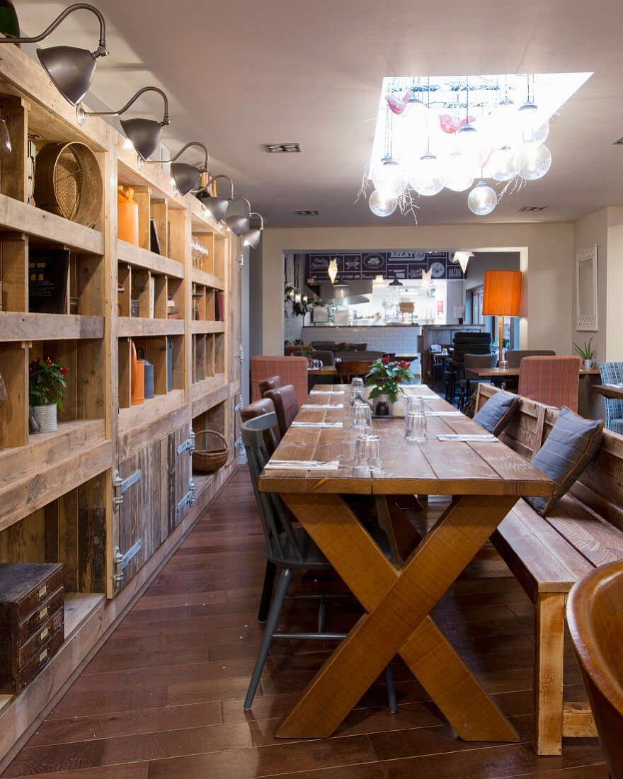 Rustic wooden table and chunky open-fronted shelving