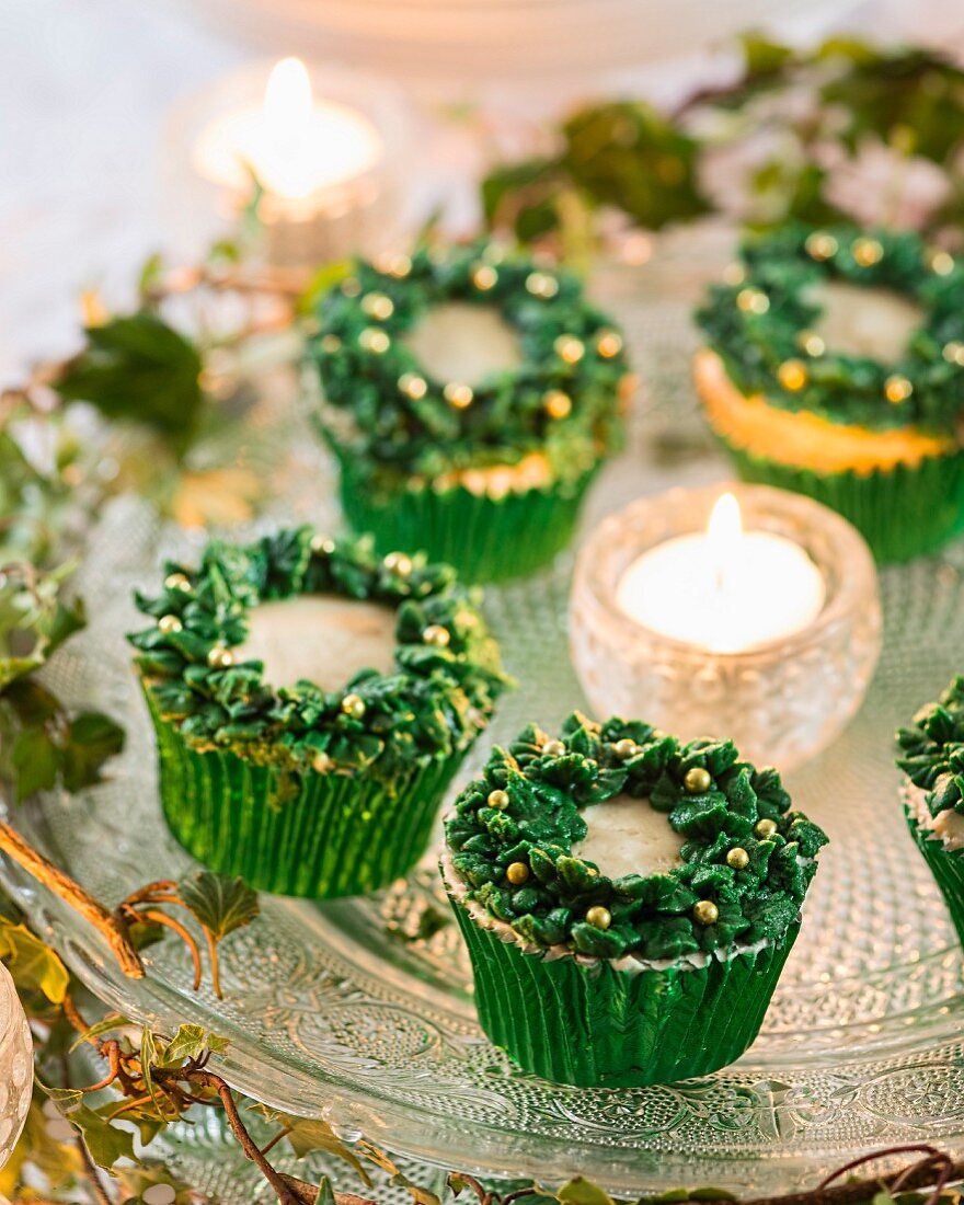 Festive cupcakes and tealight on cake plate