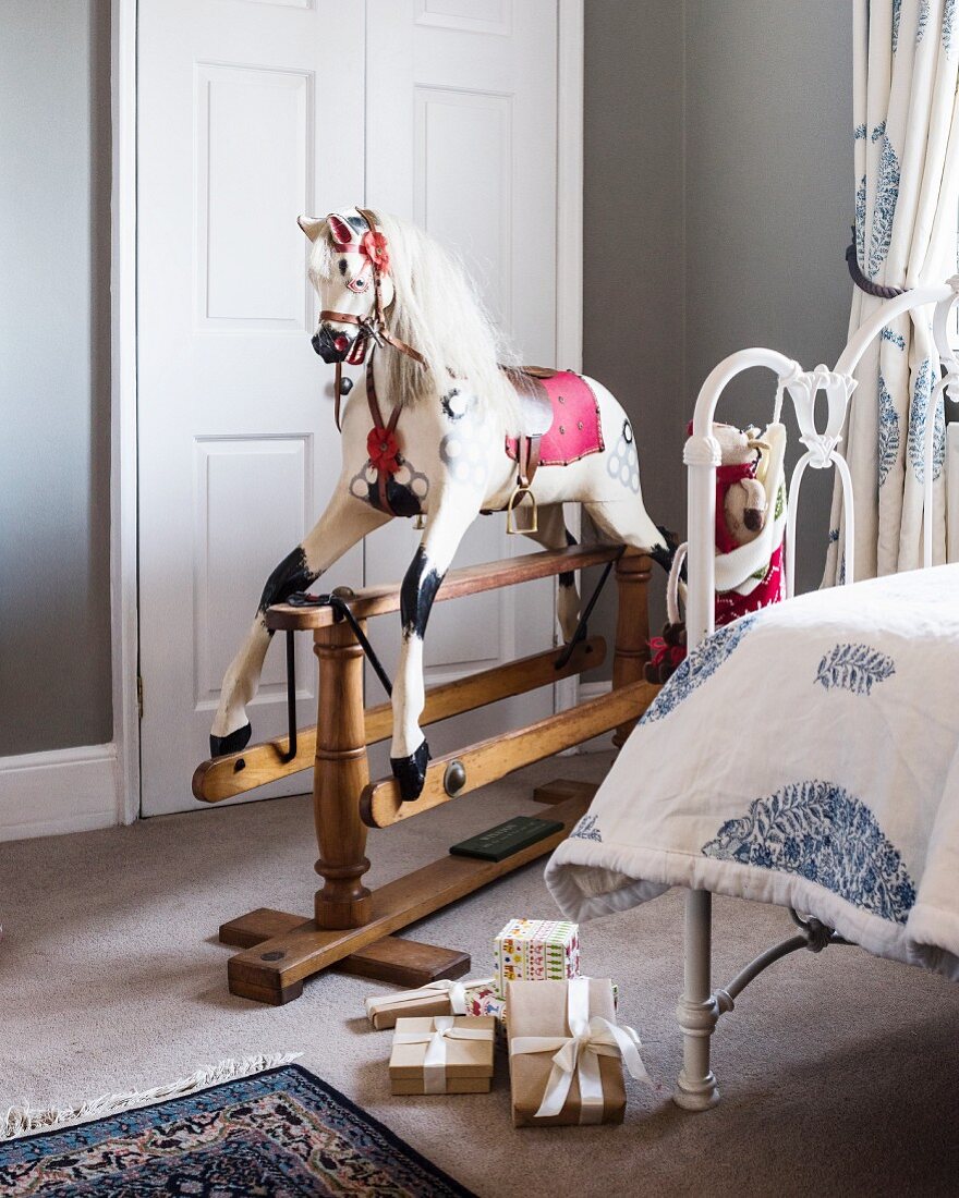 Old-fashioned rocking horse in child's bedroom