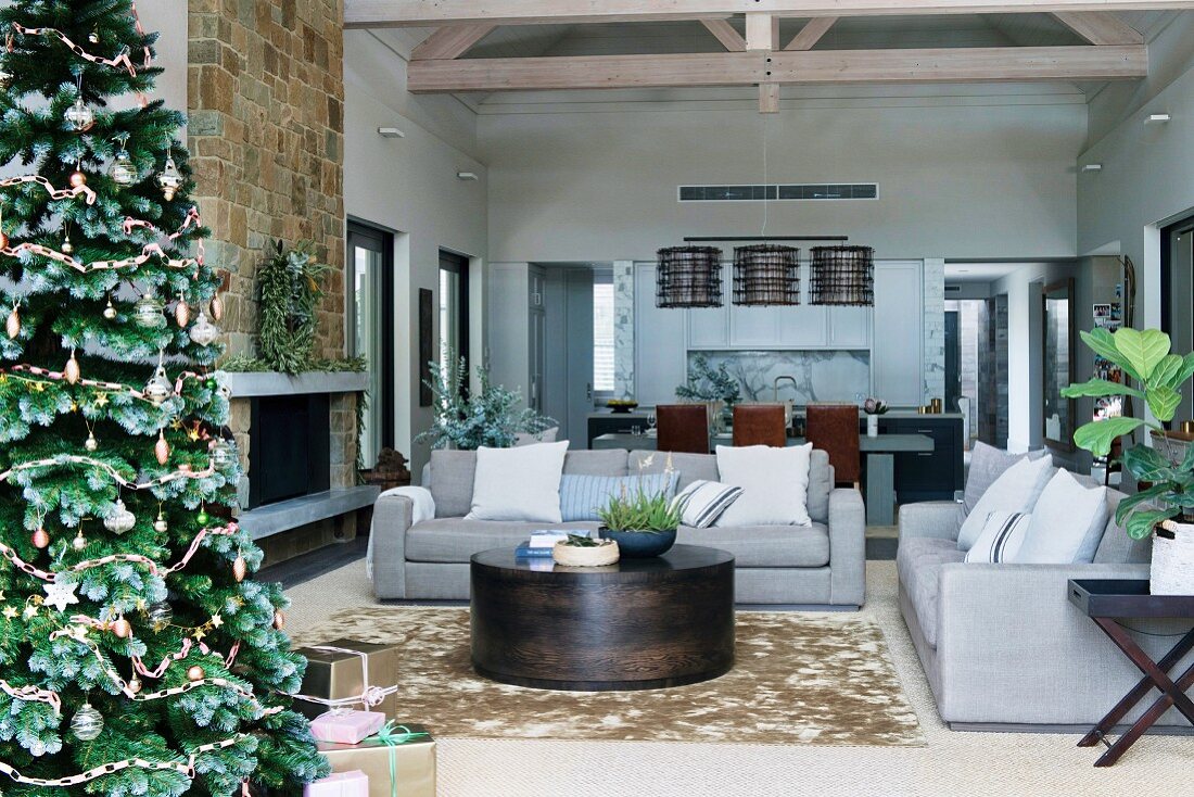 Modern living room in earth tones with Christmas tree