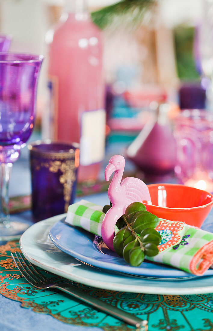 Flamingo napkin ring on table set for Christmas in bright colours