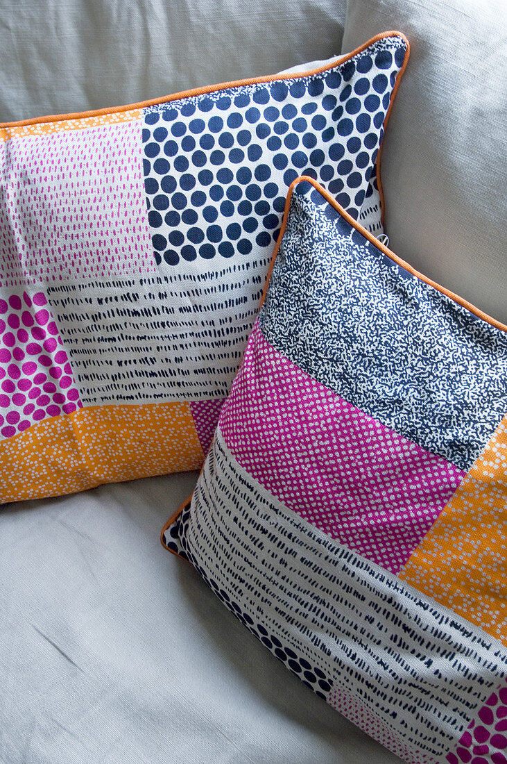 Multicoloured scatter cushions on sofa