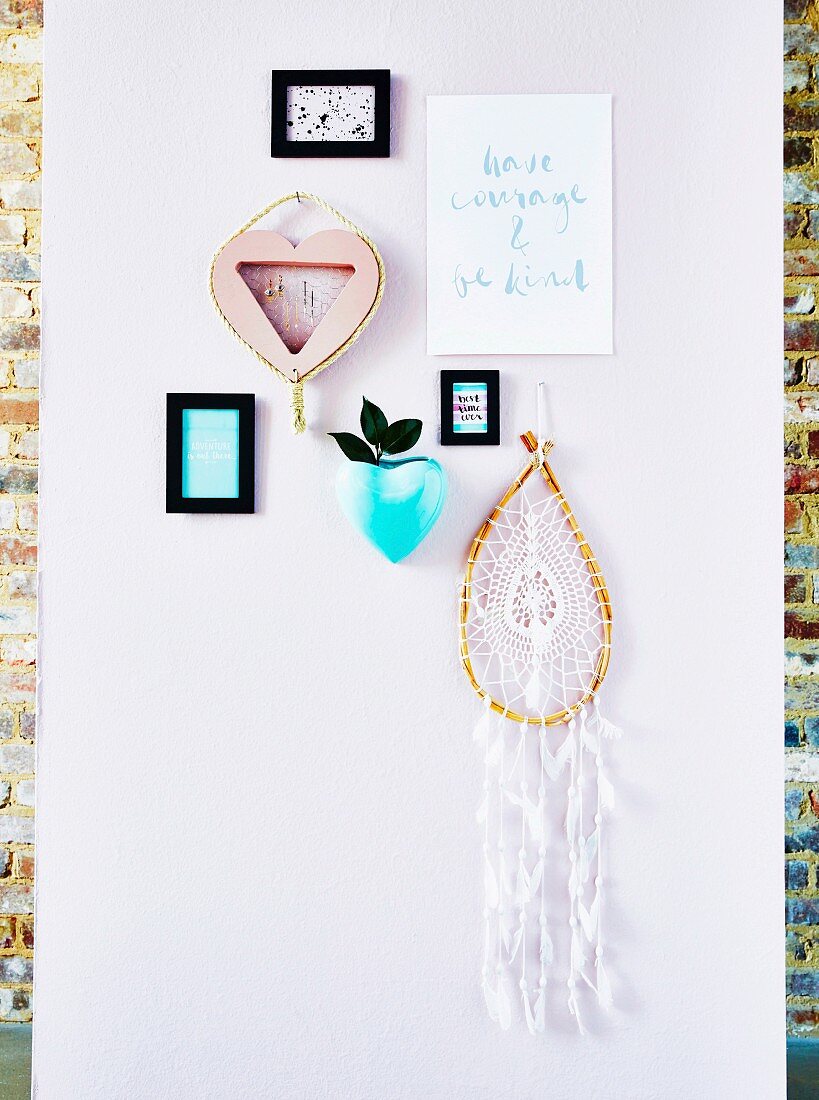 Wall with pictures, dream catcher and homemade jewelry holder