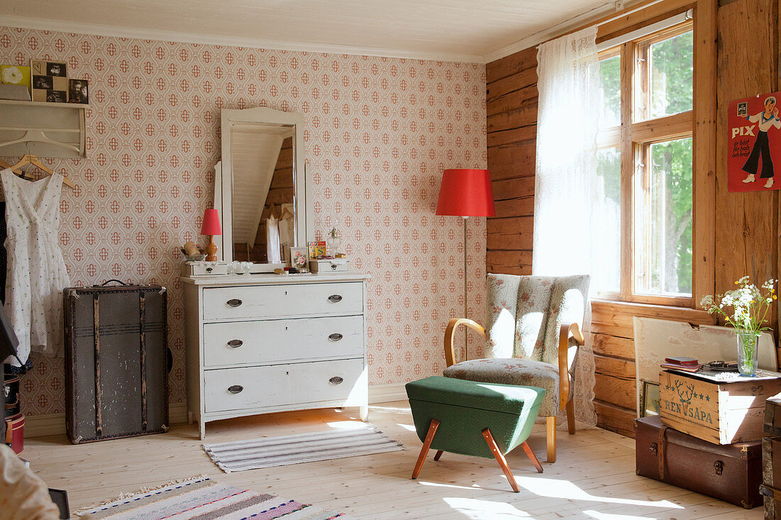 Retro furniture and old suitcases in vintage-style bedroom