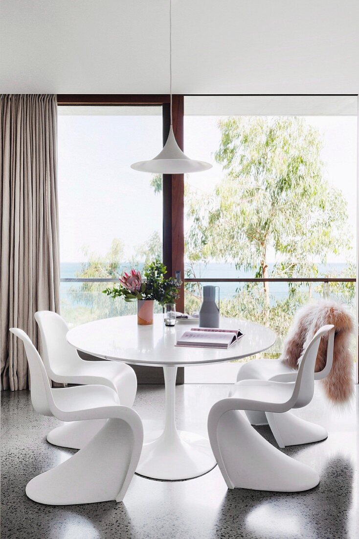Dining room with designer furniture and panoramic sea views