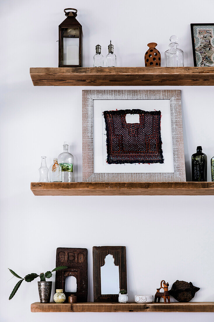 Ethnic decoration on rustic shelves