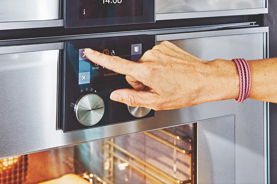 The control panel of an all-in-one kitchen appliance with oven, steamer and warming drawer