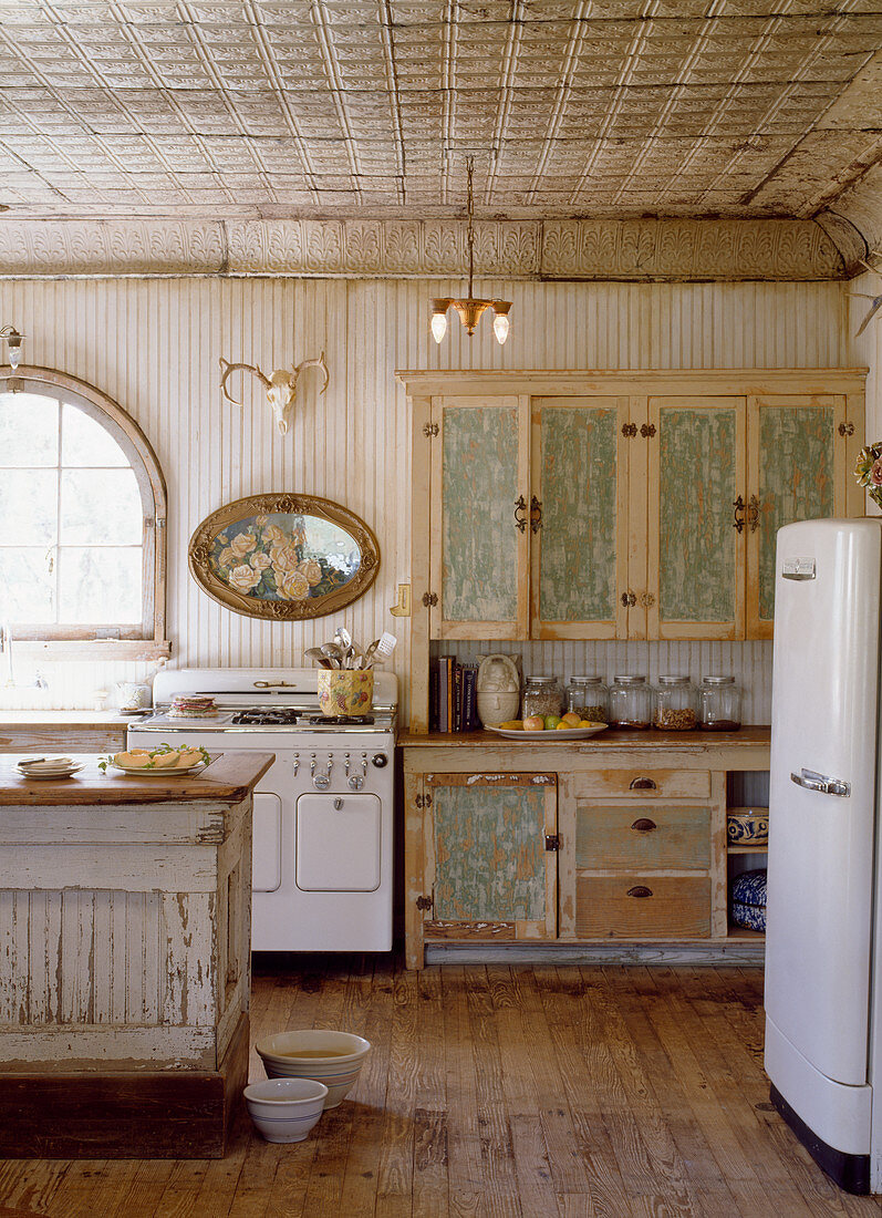 Dresser and retro fridge in shabby-chic kitchen