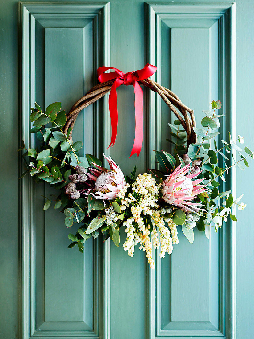 Exotic door wreath made of eucalyptus twig and protea