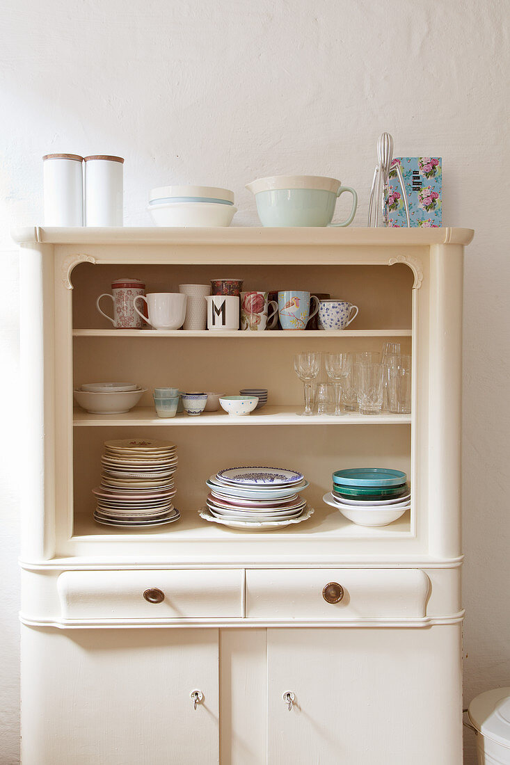 Crockery in old kitchen dresser with open top
