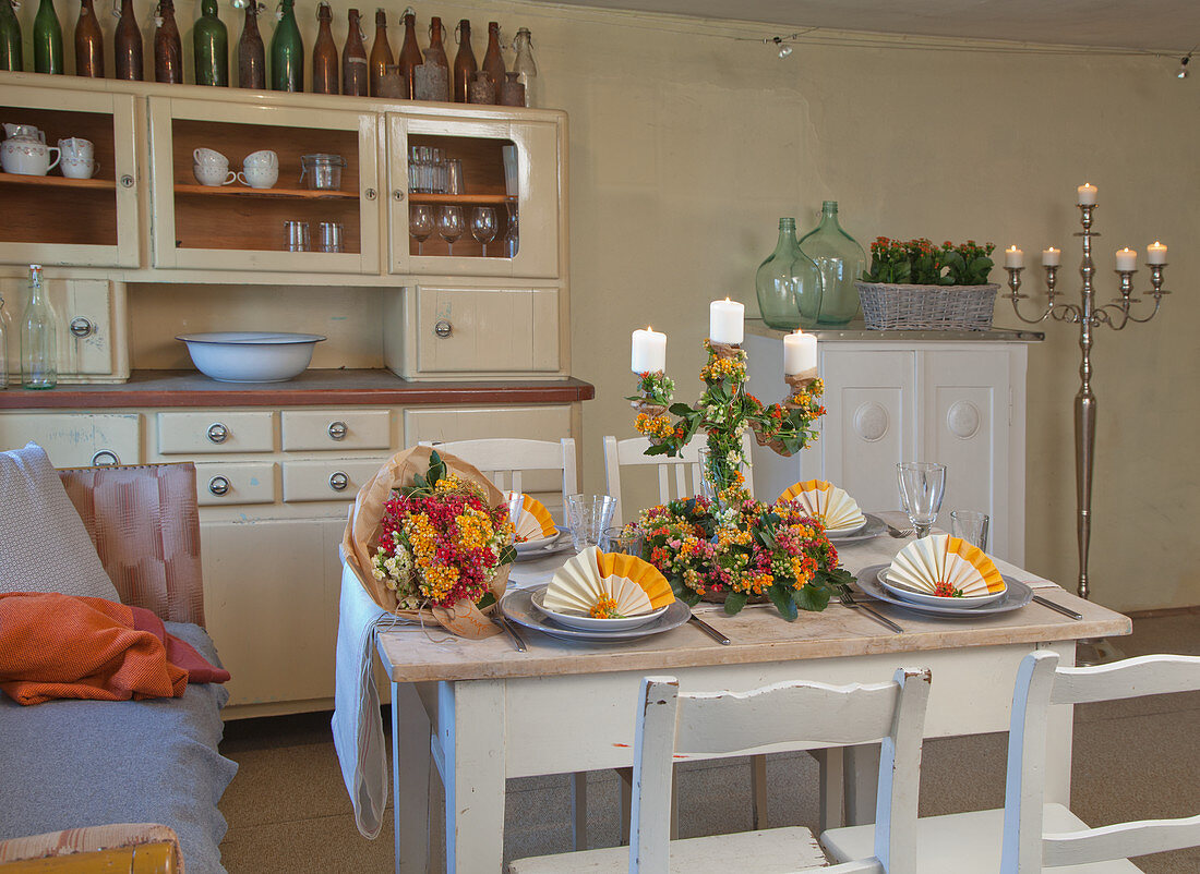 Country-house-style table decorated with flaming Katy