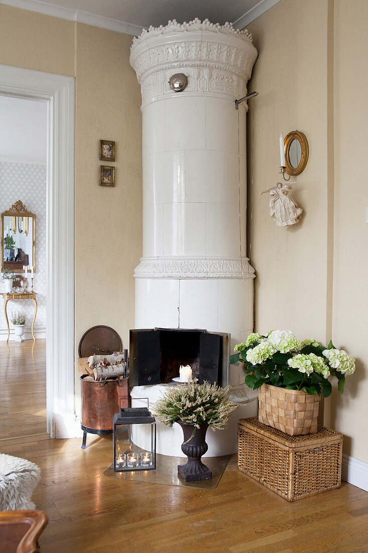 Round, Swedish tiled stove against cream walls
