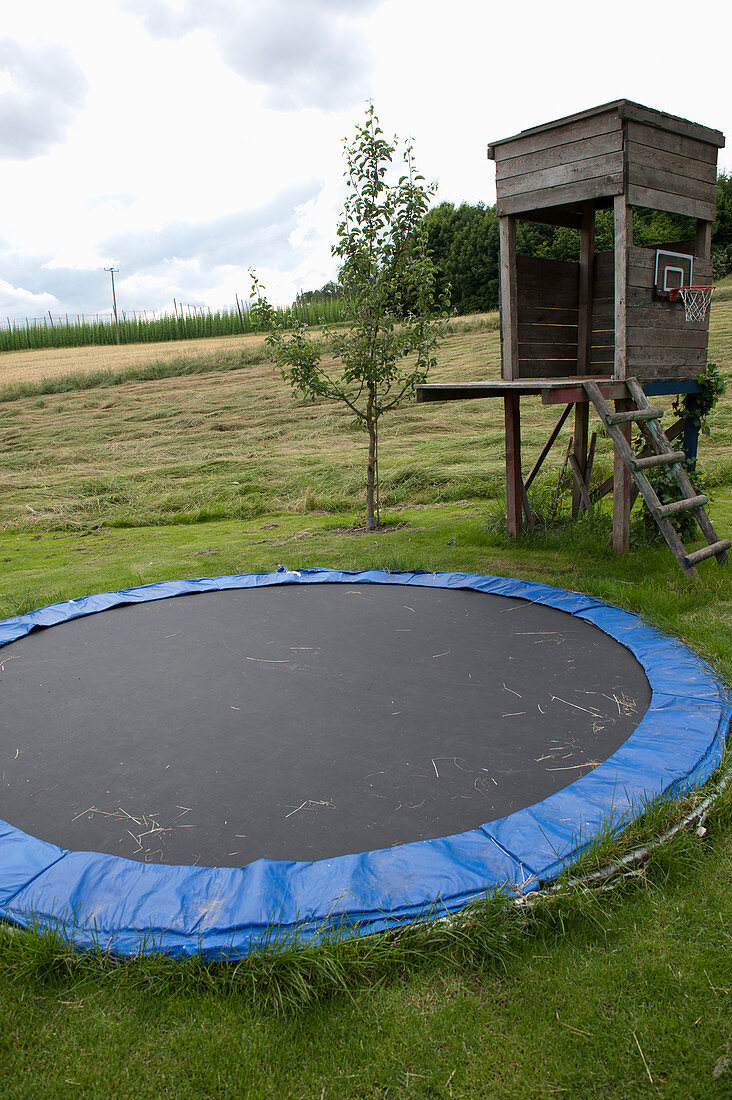 Play area for children, trampoline sinks in the ground
