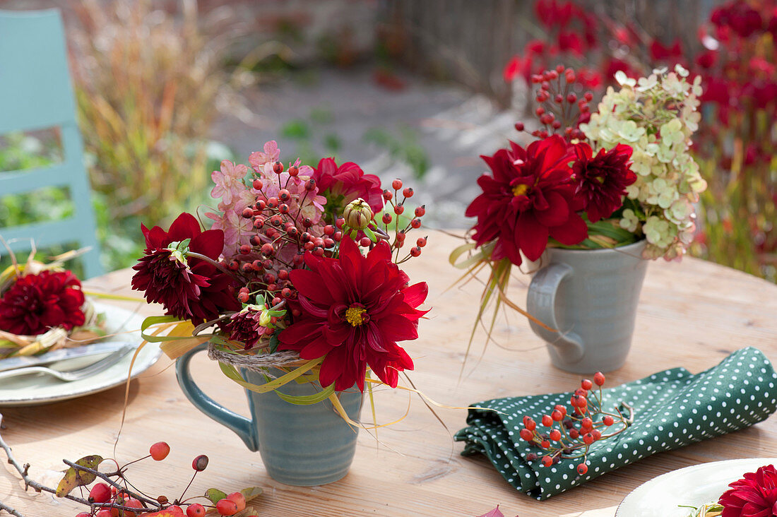 Small autumn bouquets in cups
