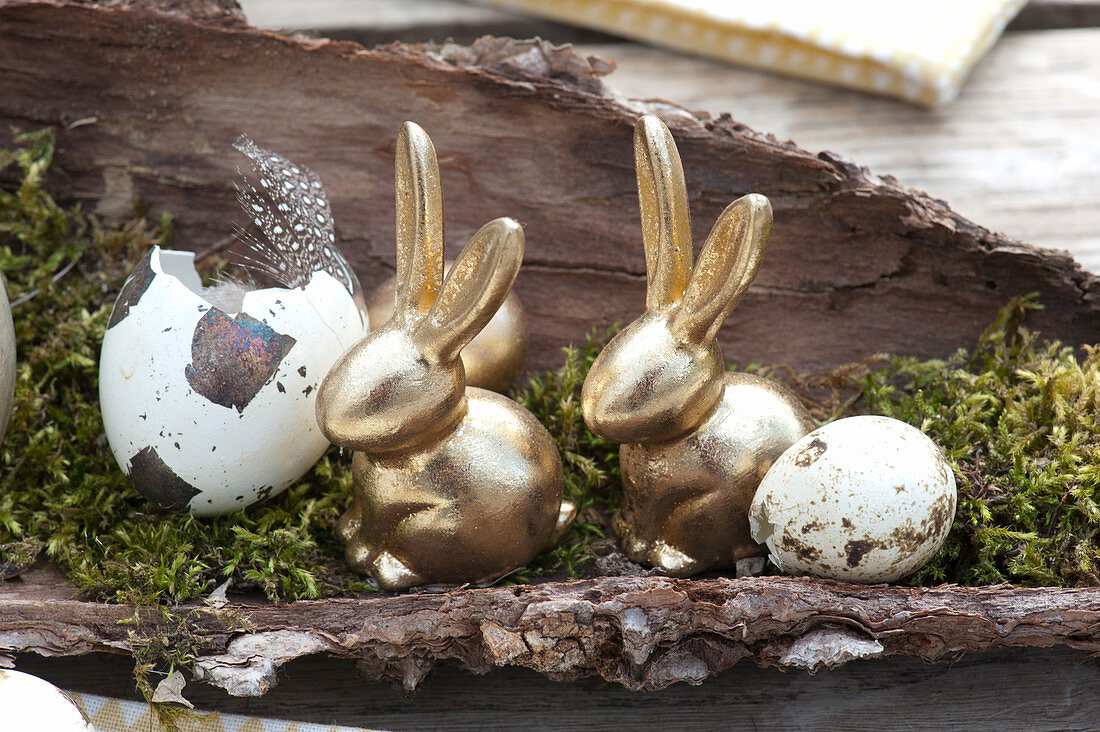 Unusual Easter table decoration with golden easter bunnies