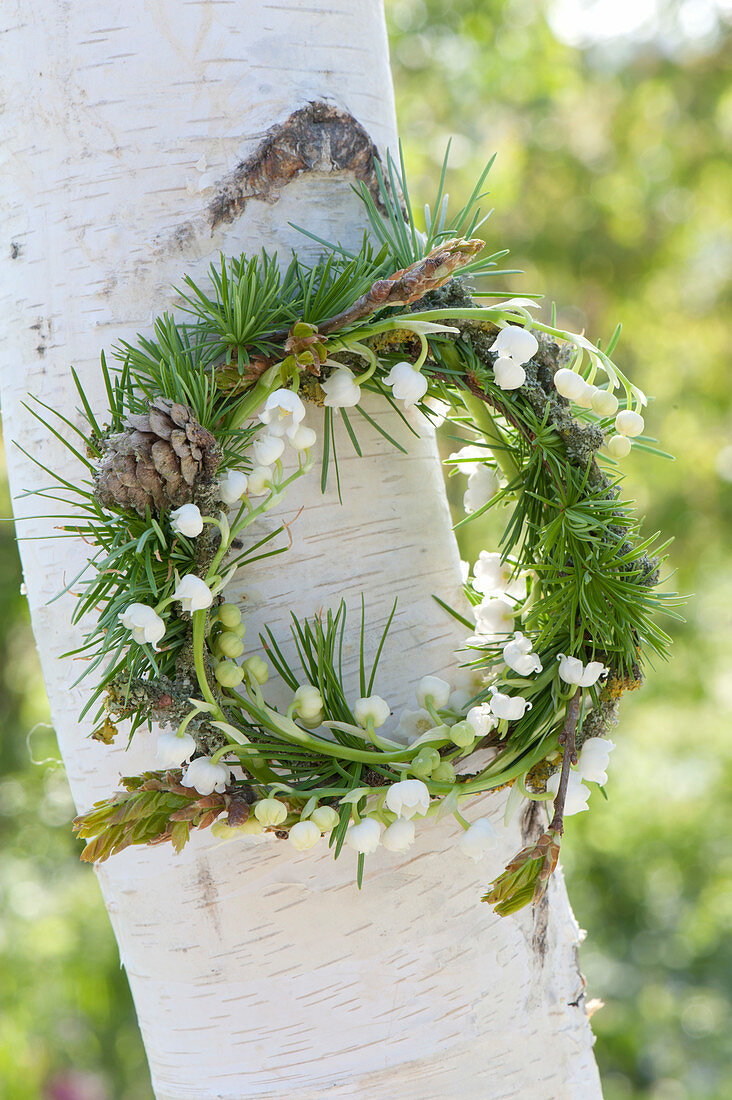Small wreath of Convallaria majalis (lily of the valley) with twigs
