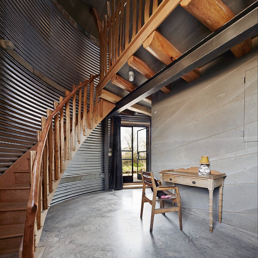 Wooden staircase in converted silo