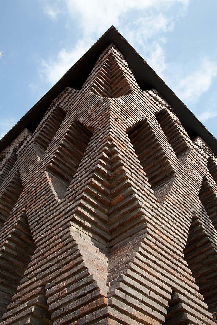 Modern, architect-designed brick house with diamond-shaped apertures in façade