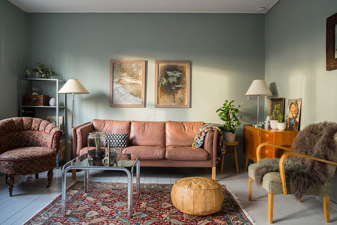 Vintage furniture in living room with blue-grey walls